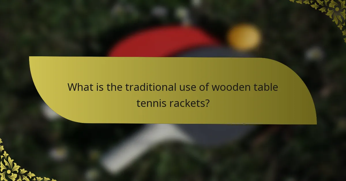 What is the traditional use of wooden table tennis rackets?
